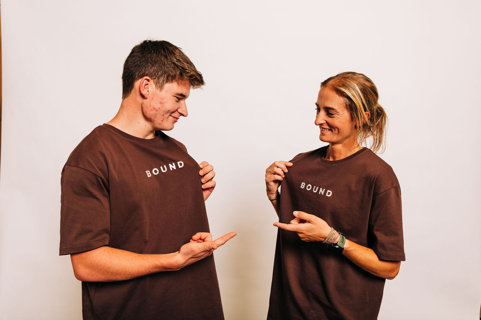 Two friends in matching brown Off-Day Tees