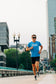 Runner in the Smooth Splits Short Sleeve running toward camera downtown
