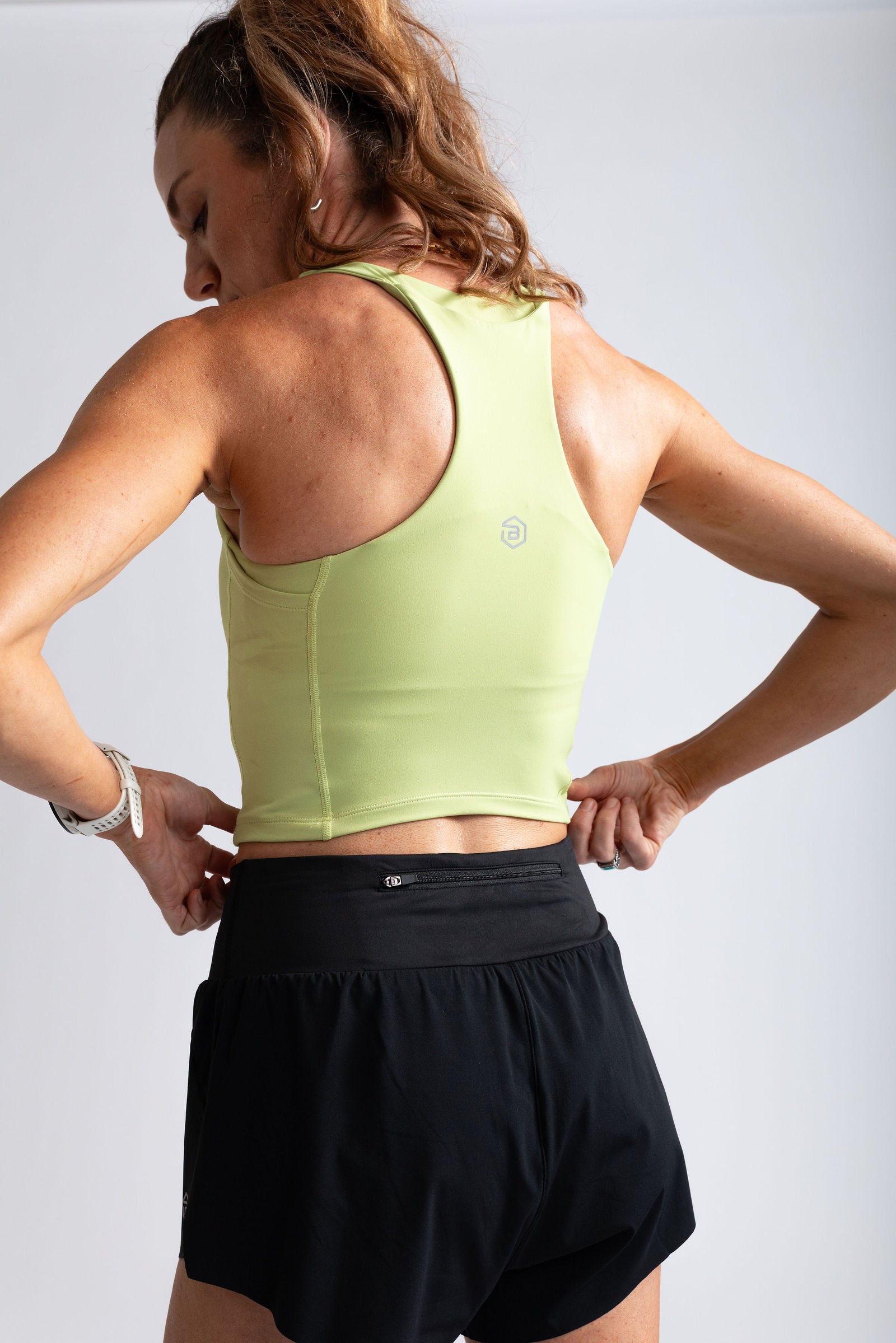 Tempo Crop in Acacia - close-up of the racerback and soft fabric