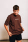 Man in The Off-Day Tee tugging the hem to show length and fit