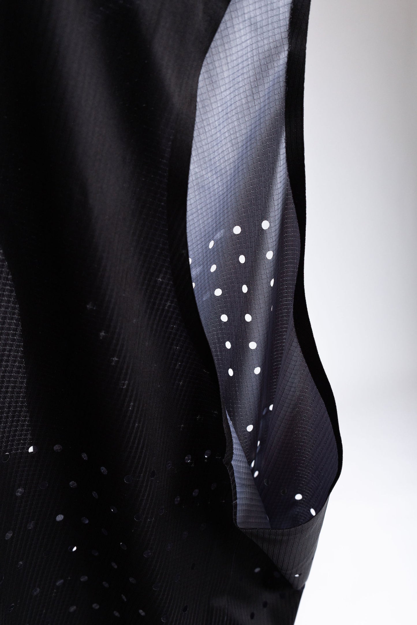 PR Singlet side panel showing perforated fabric and inner lining