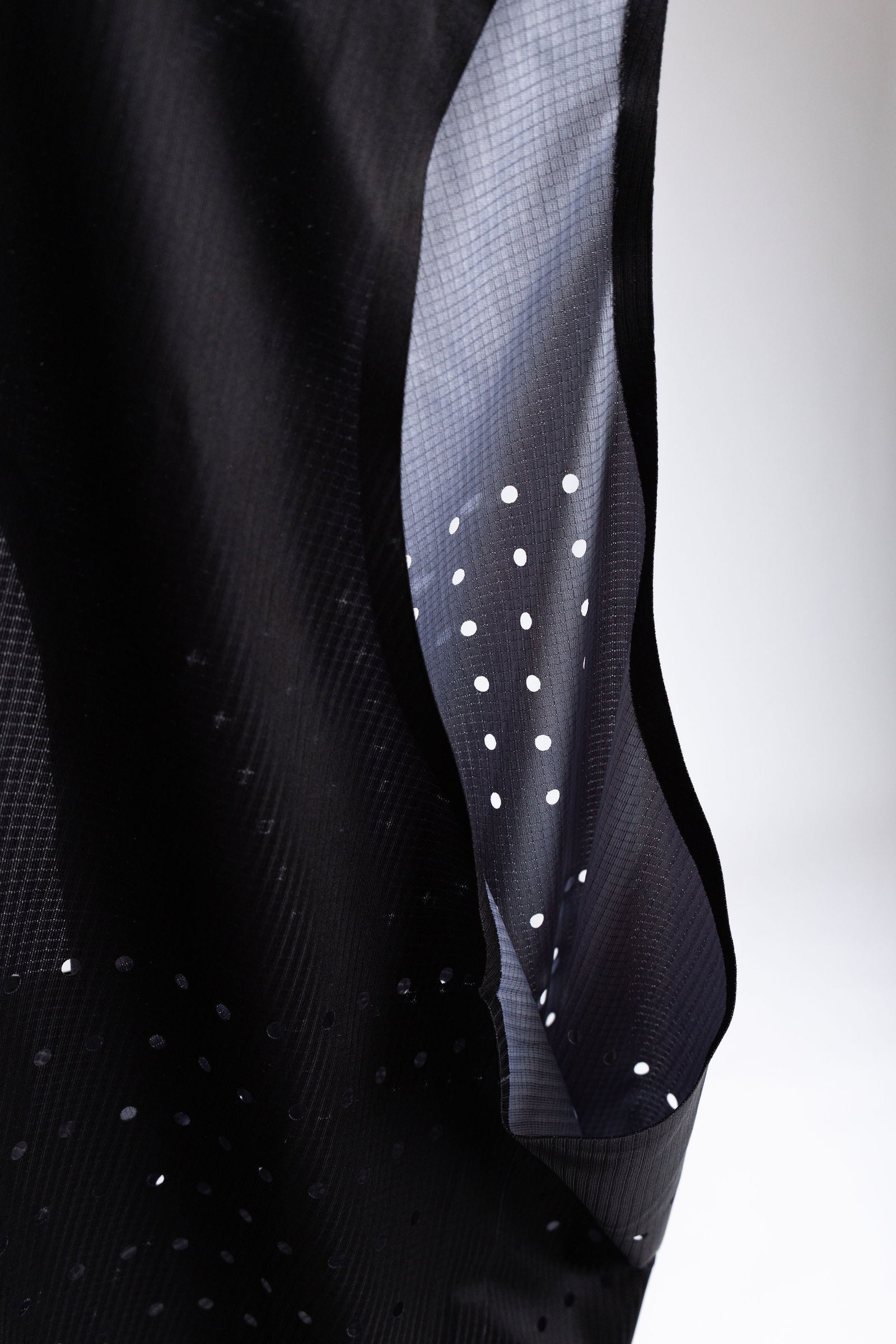 PR Singlet side panel showing perforated fabric and inner lining