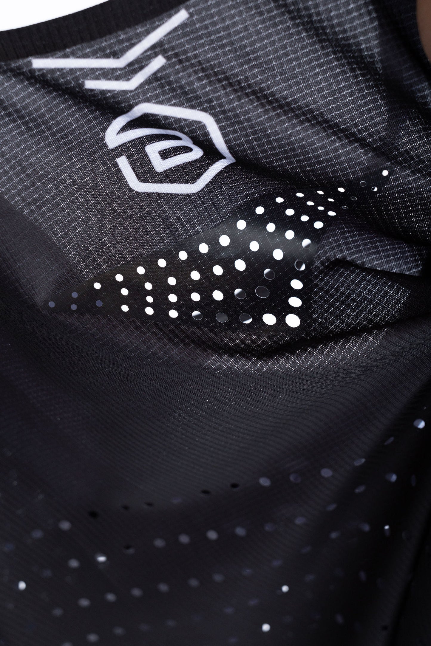 Close-up of lightweight PR Singlet fabric showing laser-cut ventilation holes