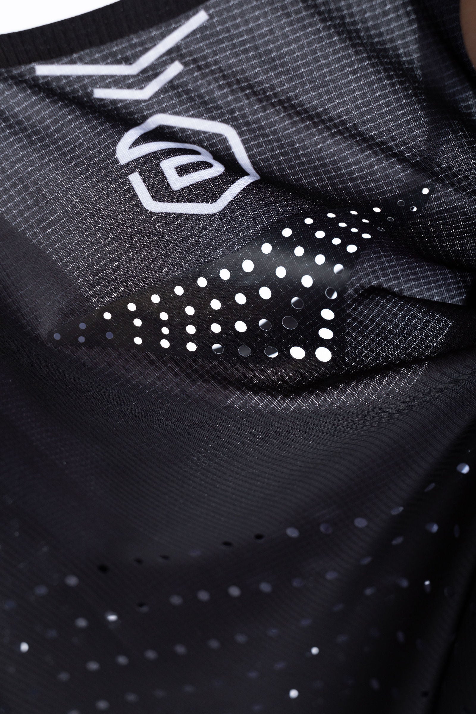 Close-up of lightweight PR Singlet fabric showing laser-cut ventilation holes