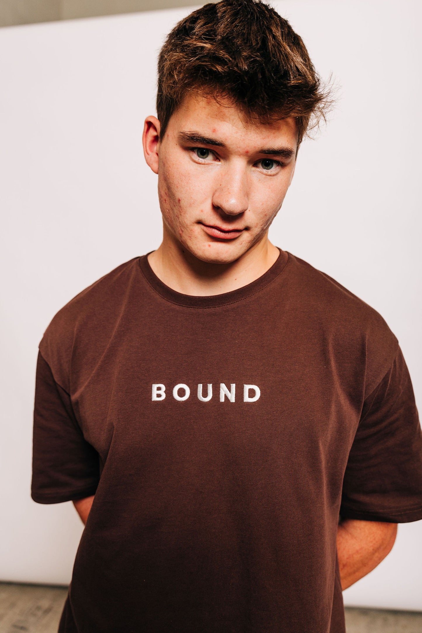Man wearing The Off-Day Tee, front view showing the boxy fit