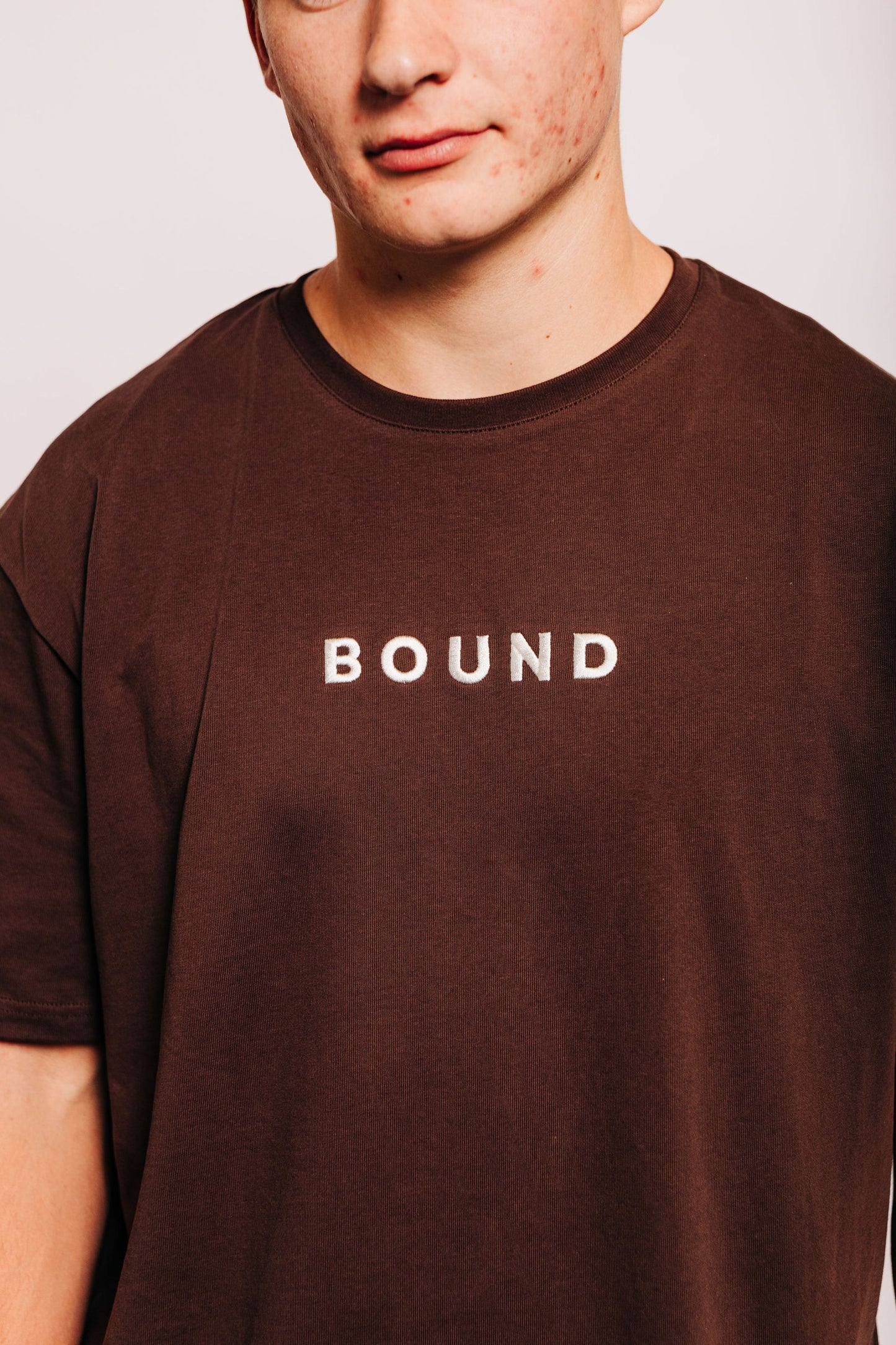 Close-up of The Off-Day Tee on a man, showing the crew neck and heavyweight cotton