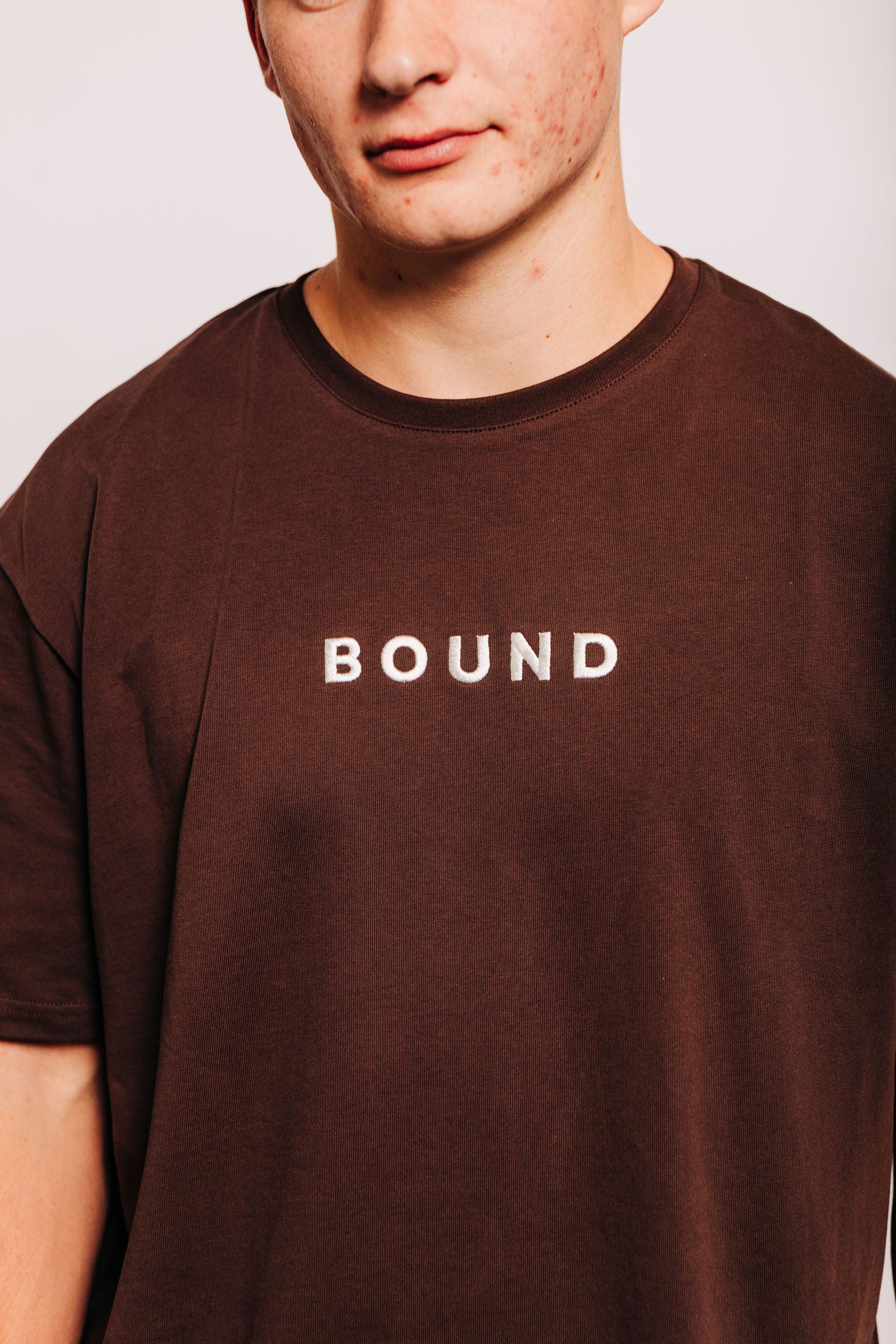 Close-up of The Off-Day Tee on a man, showing the crew neck and heavyweight cotton