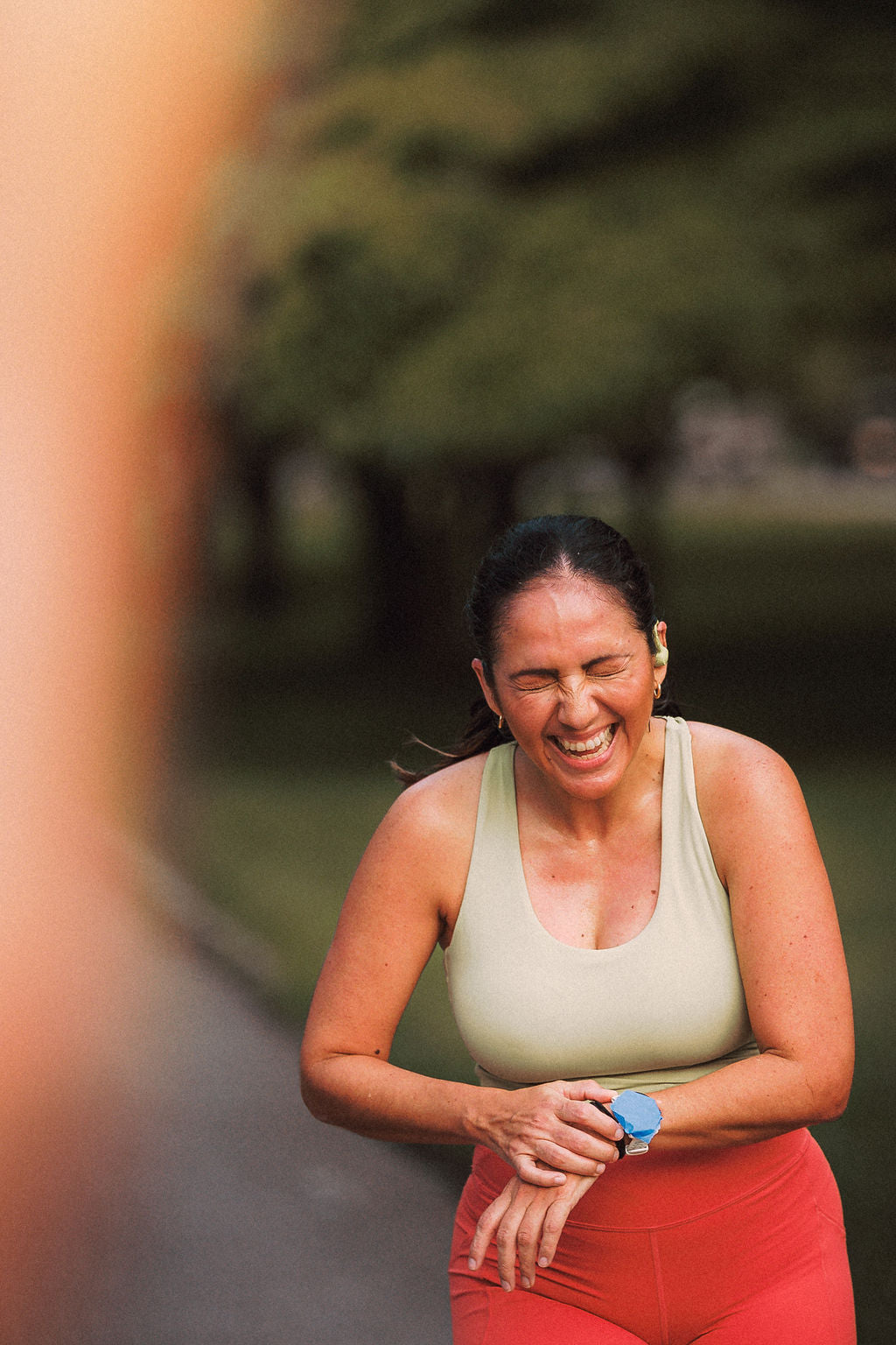 A runner laughing after the race at BOUND Show Up to Blow Up. Photo by Nick Morgan Photography