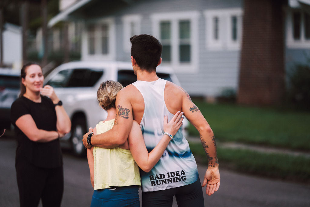 Runners hugging after BOUND Show Up to Blow Up. Photo by Nick Morgan Photography